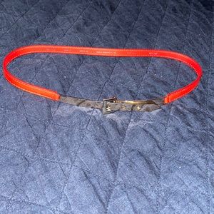 Skinny belt, Jacob, XS. Orange, with gold metal clasp feature. 3 holes.